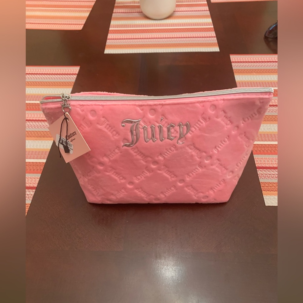 NWT Juicy Couture Pink Soft
Cosmetic Makeup Bag W/1 travel bottle.